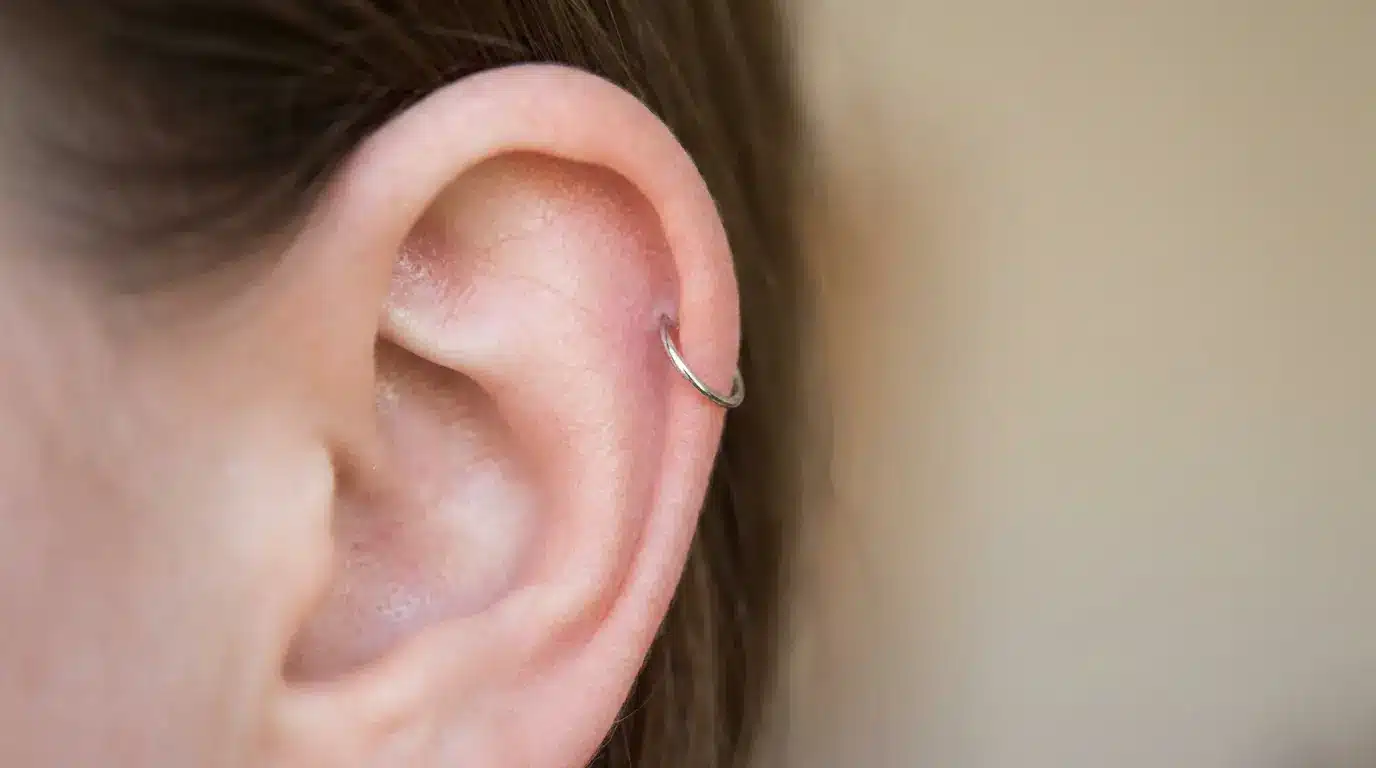 Auricle piercing with a small hoop earring