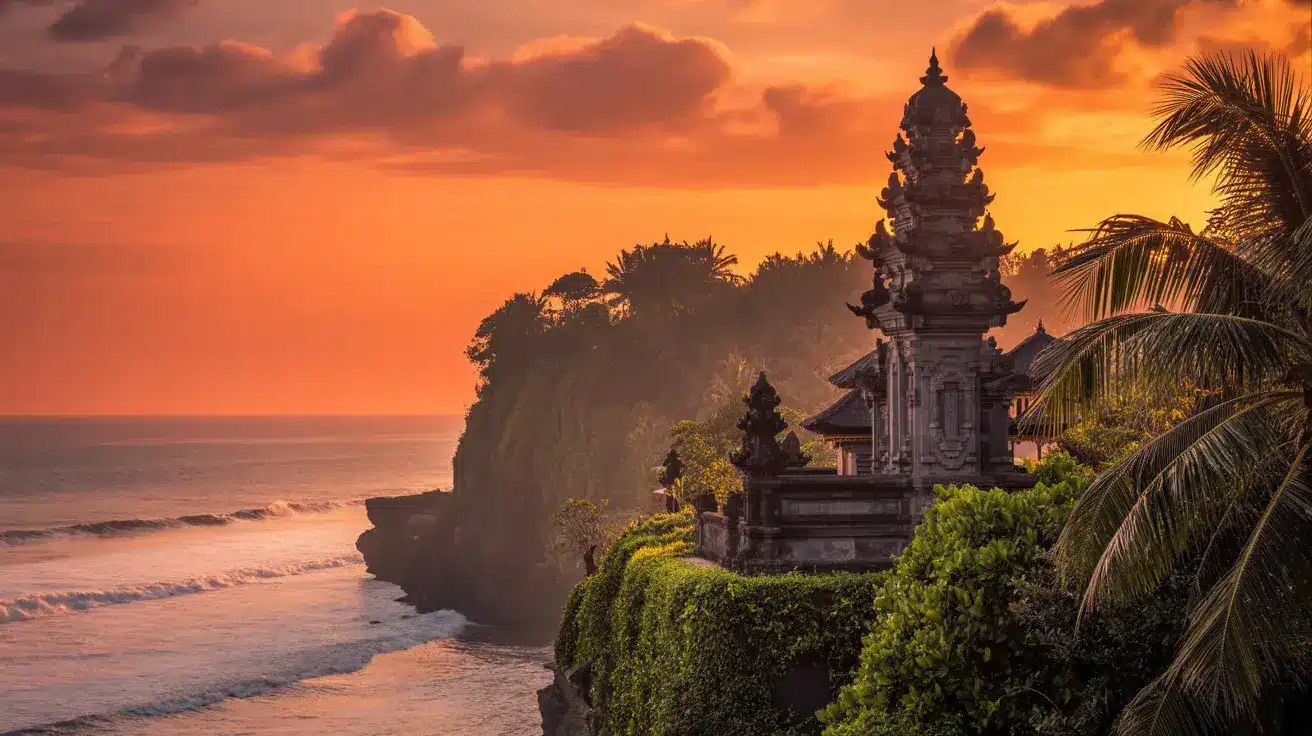 Bali, Indonesia, with a traditional temple perched on a cliff surrounded by lush greenery and palm trees