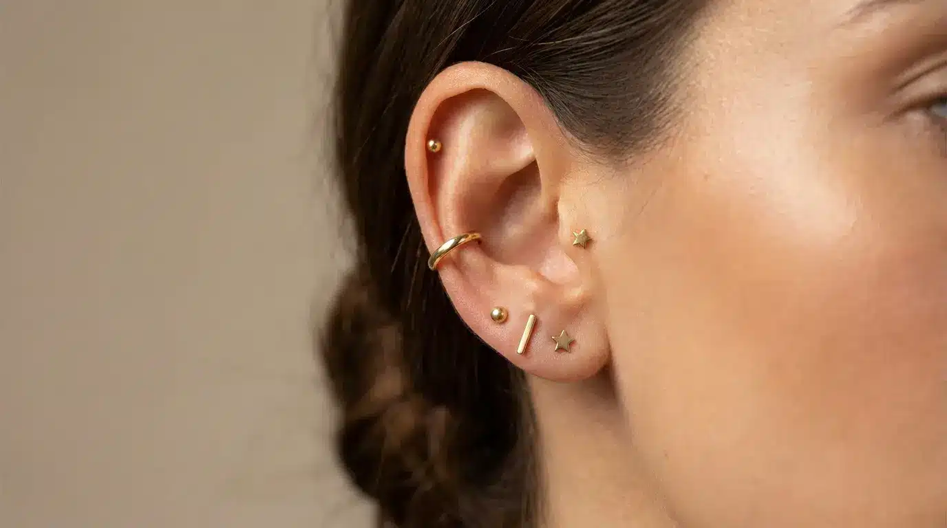 Curated ear stack with all gold jewelry