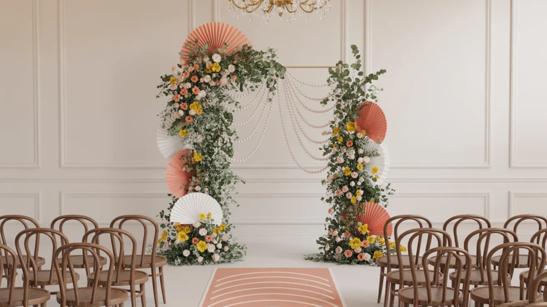 Indoor floral wedding arch with fans and garland in a soft blush ceremony room.