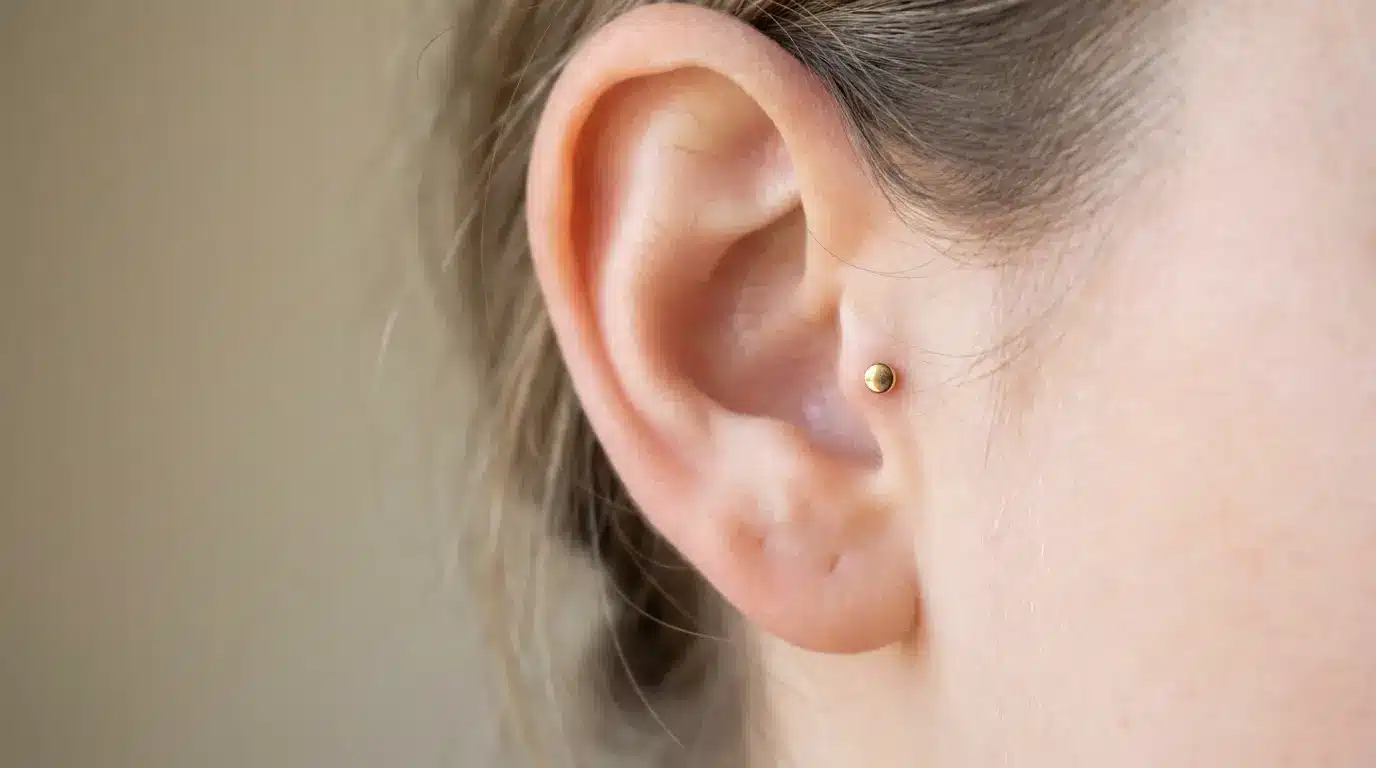 Tragus piercing with minimalist stud jewelry