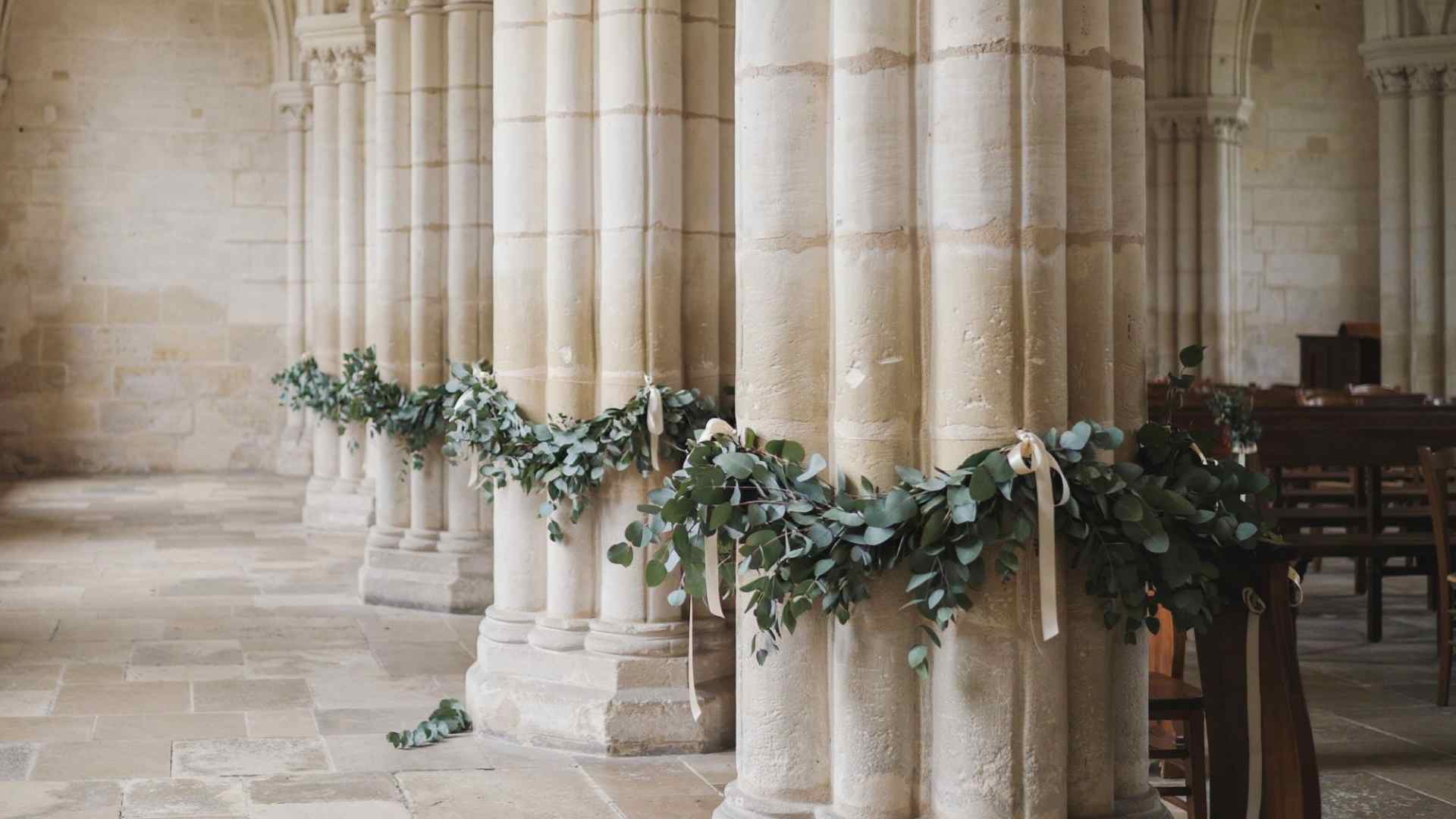 Greenery garlands decorating church columns and railings