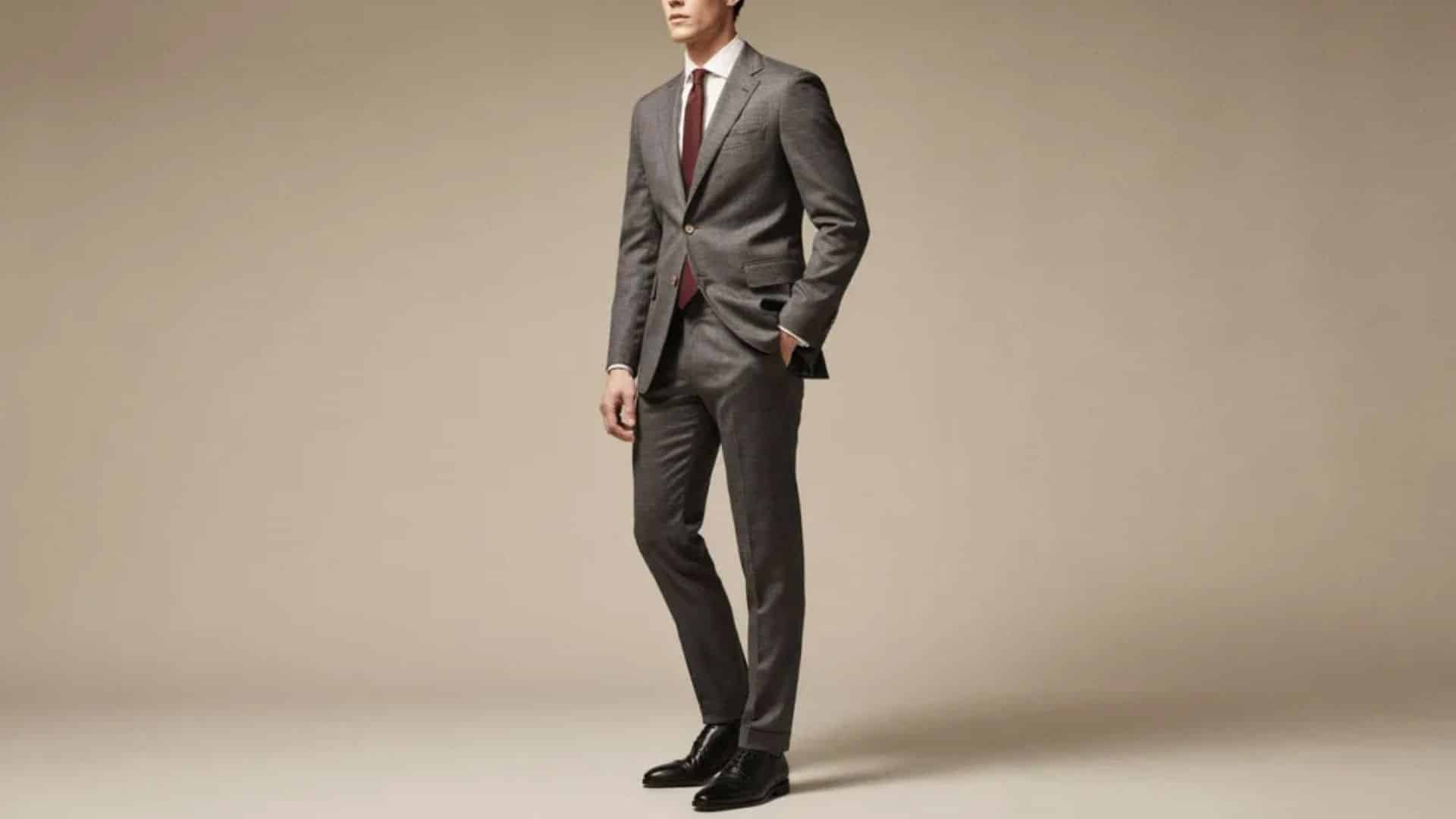 Man wearing a slim wool suit with refined texture for a sophisticated cocktail wedding outfit