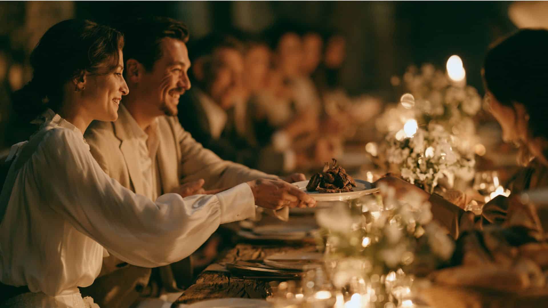 Non traditional wedding ideas featuring a family style reception dinner with shared plates, rustic table setting, and guests