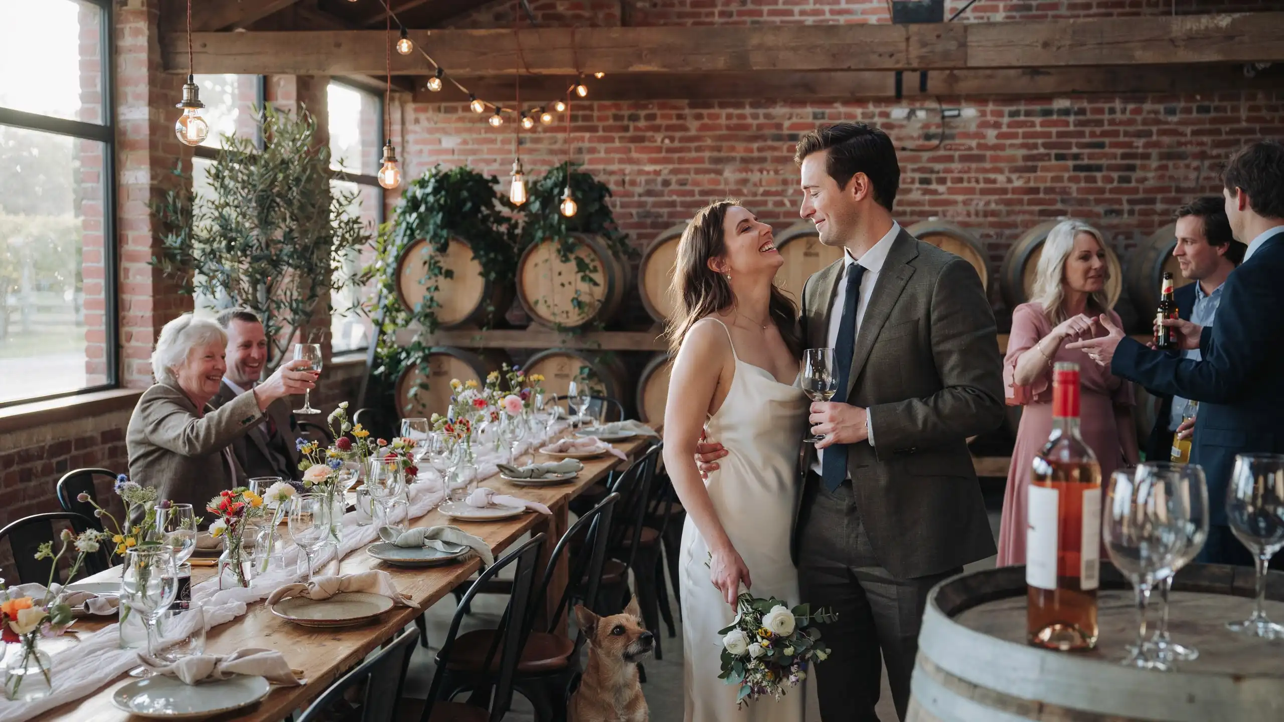 Non traditional wedding ideas featuring an intimate winery reception with rustic tables, floral decor, and newlyweds celebrating