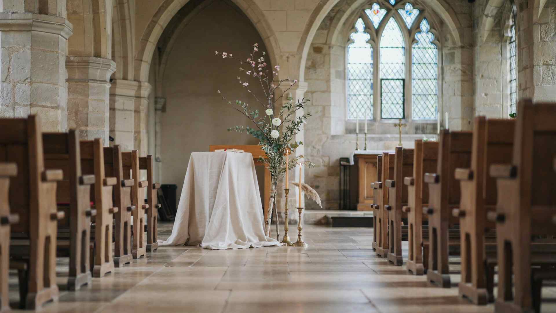 Seasonal branch arrangement decorating a church wedding altar