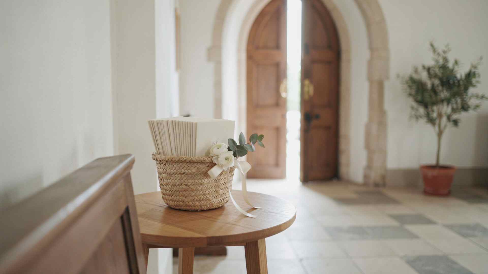 Wedding program basket station at a church entrance