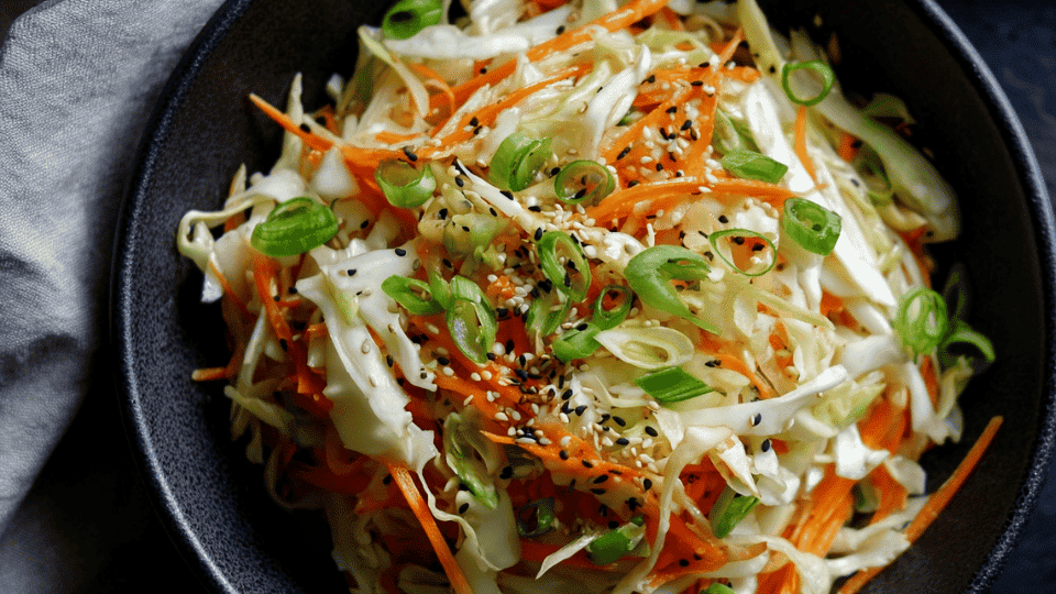Japanese cabbage slaw with sesame seeds and shredded carrots