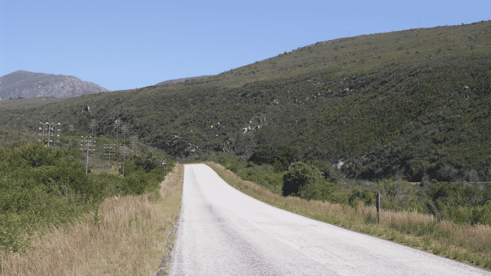 Scenic Route 62 winding through mountains and dry Klein Karoo landscapes in South Africa.
